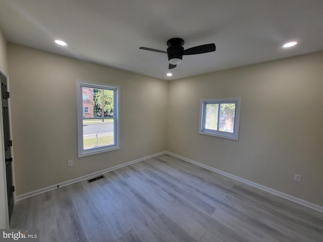 empty room featuring light hardwood / wood-style flooring and ceiling fan