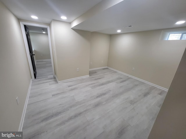 basement featuring light hardwood / wood-style flooring