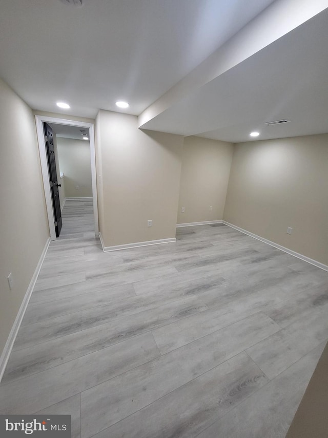 basement featuring light wood-type flooring