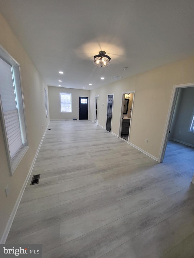 unfurnished room with light hardwood / wood-style flooring