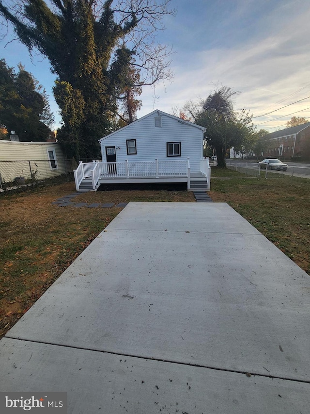 exterior space featuring a yard and a wooden deck