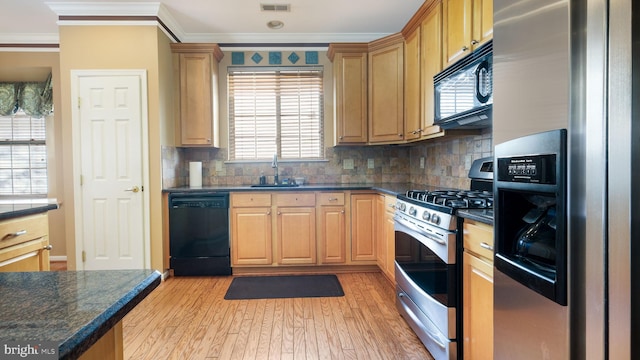 kitchen with light hardwood / wood-style floors, black appliances, sink, ornamental molding, and backsplash