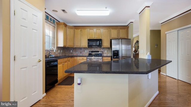 kitchen with black appliances, sink, crown molding, backsplash, and light hardwood / wood-style flooring