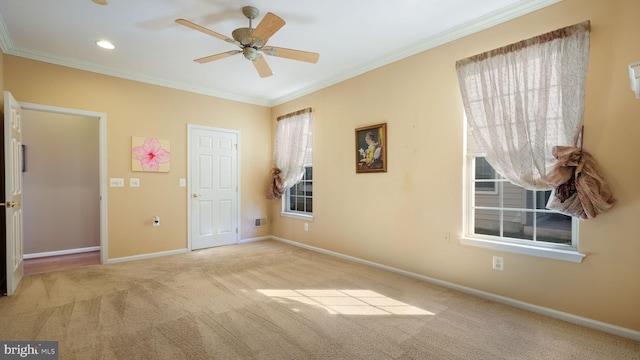 unfurnished bedroom with ceiling fan, multiple windows, and crown molding