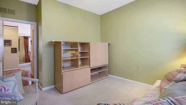 interior space featuring light carpet