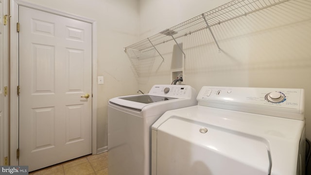 clothes washing area featuring washing machine and dryer