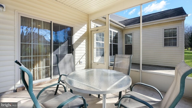 sunroom / solarium with wood ceiling