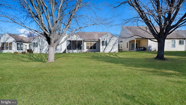 view of yard featuring a sunroom