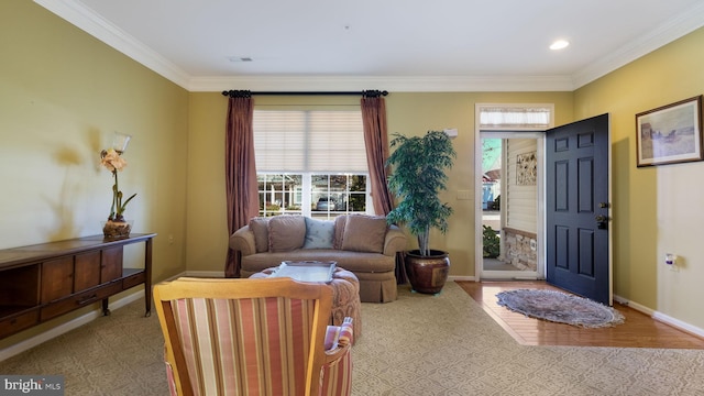 entryway featuring ornamental molding and light hardwood / wood-style floors