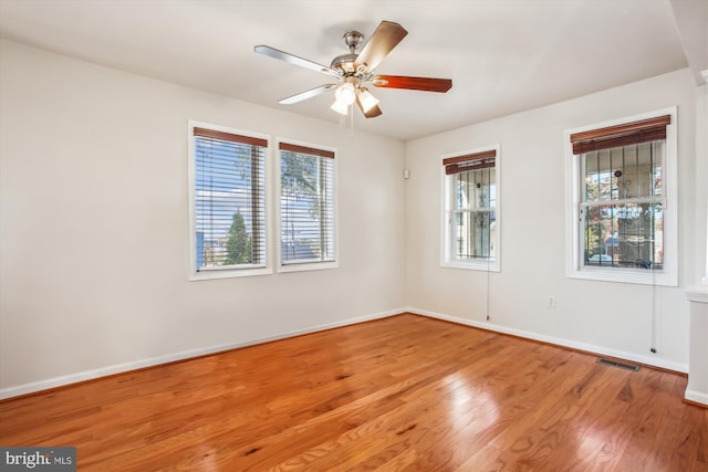 spare room featuring ceiling fan and light hardwood / wood-style floors