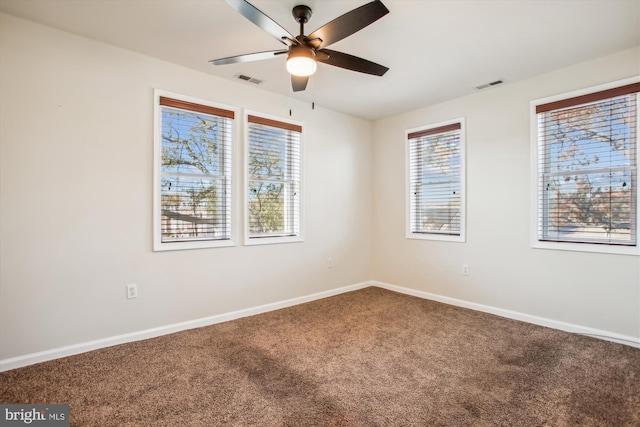 carpeted empty room featuring ceiling fan