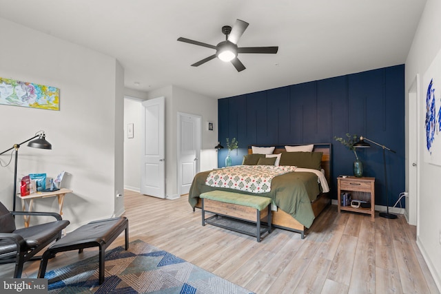 bedroom featuring ceiling fan and light wood-type flooring