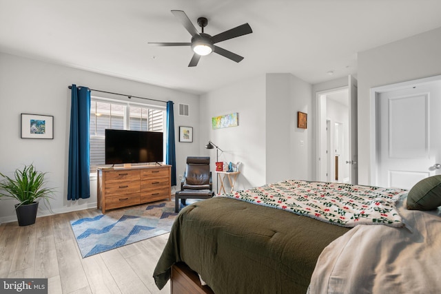 bedroom featuring ceiling fan and light wood-type flooring