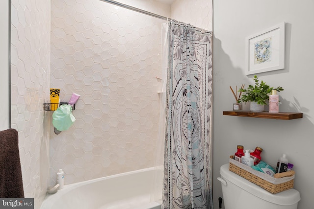 bathroom with shower / bath combo and toilet