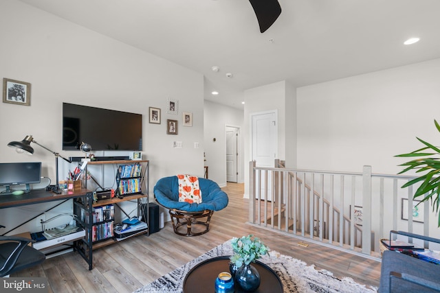 sitting room with hardwood / wood-style flooring