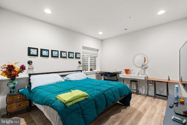 bedroom with light hardwood / wood-style flooring