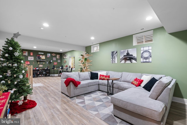 living room with a healthy amount of sunlight and light wood-type flooring