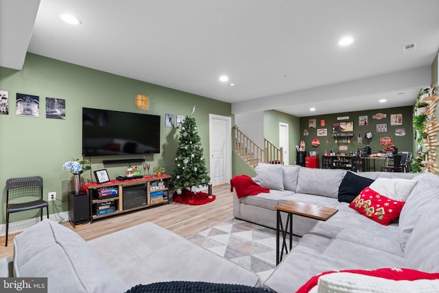 living room with light hardwood / wood-style flooring