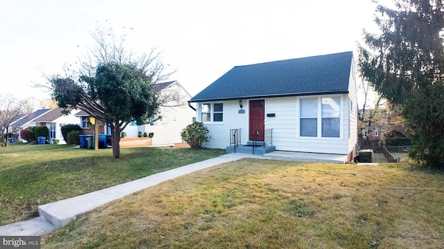 view of front of property featuring central air condition unit and a front yard