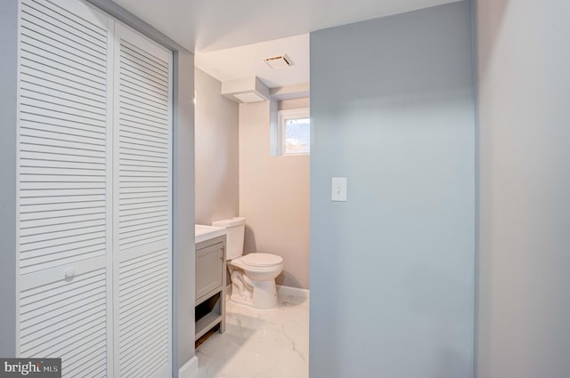 bathroom with vanity and toilet