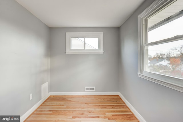 spare room with light wood-type flooring