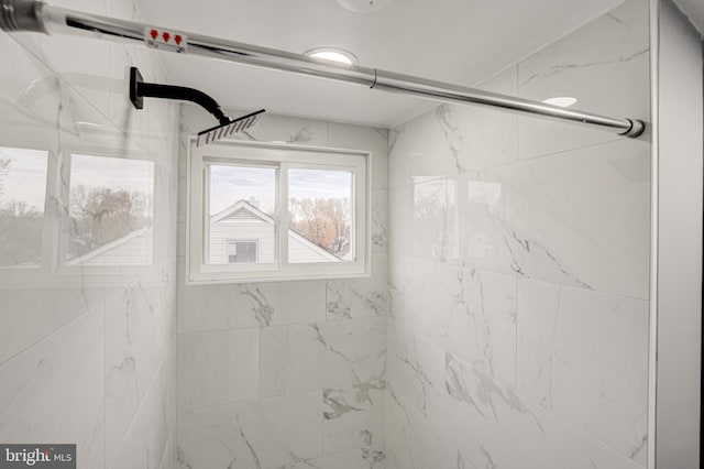 interior space featuring a shower with shower door