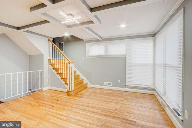 interior space with beamed ceiling, wood-type flooring, and coffered ceiling