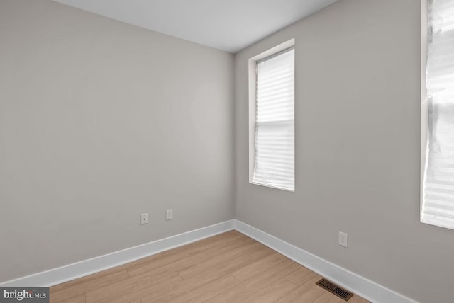 spare room with light hardwood / wood-style flooring