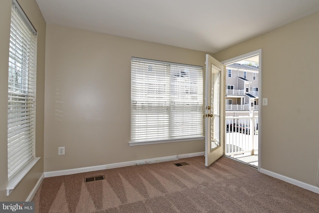 doorway featuring carpet flooring