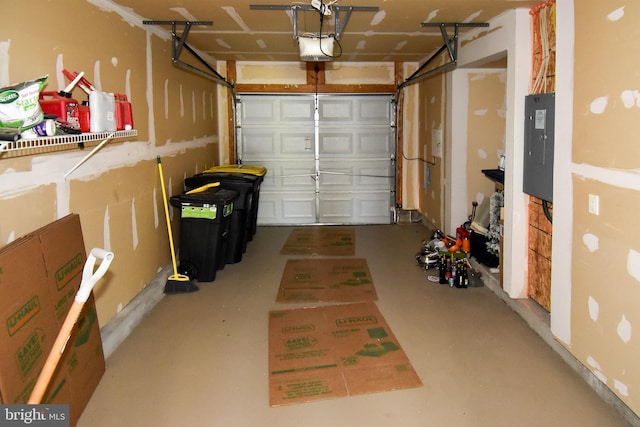 garage with electric panel and a garage door opener