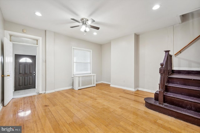 foyer with hardwood / wood-style flooring and ceiling fan