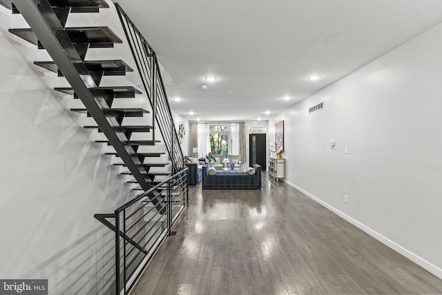 stairway featuring hardwood / wood-style floors