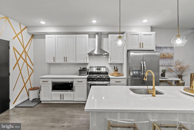 6127 Lebanon Ave, Philadelphia, PA 19151 - kitchen with wall chimney exhaust hood, stainless steel appliances, a sink, pendant lighting, and recessed lighting