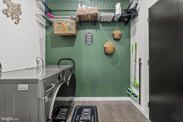 6127 Lebanon Ave, Philadelphia, PA 19151 - washroom featuring wood finished floors, separate washer and dryer, and baseboards