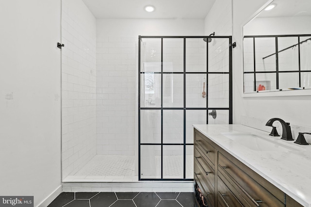 6127 Lebanon Ave, Philadelphia, PA 19151 - bathroom with a tile shower, tile patterned flooring, vanity, and recessed lighting