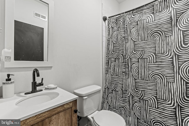 6127 Lebanon Ave, Philadelphia, PA 19151 - bathroom with toilet, vanity, and a shower with curtain