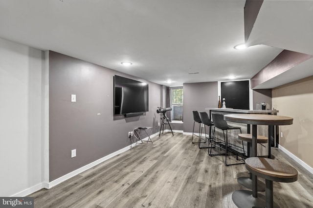 bar featuring hardwood / wood-style flooring