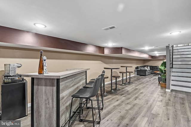 6127 Lebanon Ave, Philadelphia, PA 19151 - indoor dry bar featuring light wood finished floors, stairway, baseboards, and recessed lighting