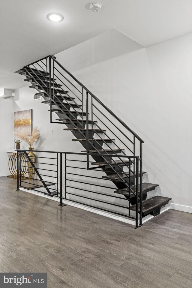 6127 Lebanon Ave, Philadelphia, PA 19151 - staircase with wood finished floors, baseboards, and recessed lighting