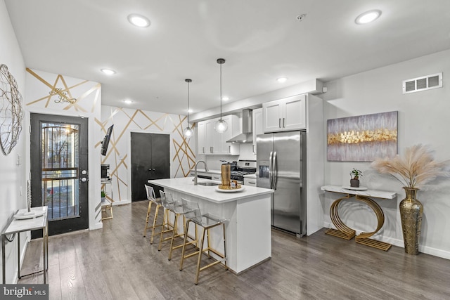 6127 Lebanon Ave, Philadelphia, PA 19151 - kitchen featuring stainless steel appliances, wall chimney range hood, a sink, baseboards, and dark wood-type flooring