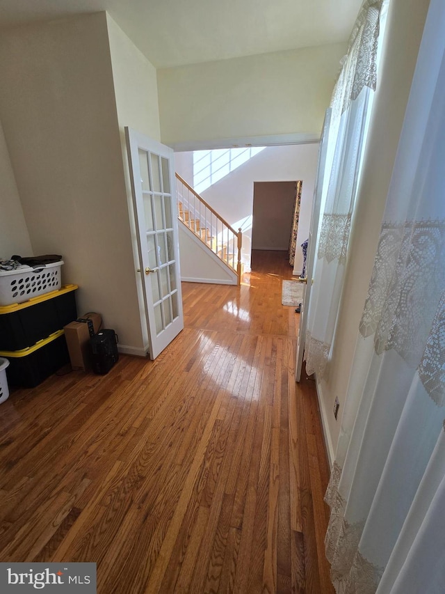 hallway featuring wood-type flooring