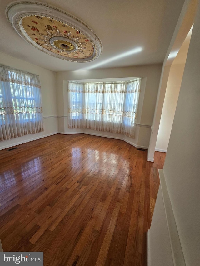 empty room featuring hardwood / wood-style flooring