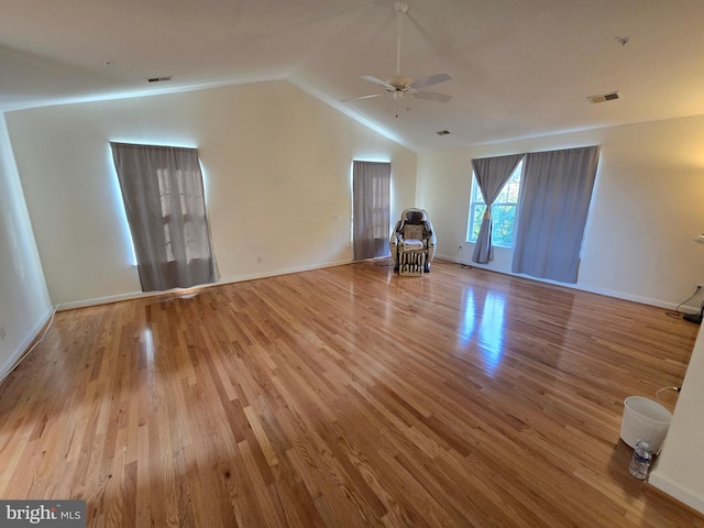 interior space featuring ceiling fan, light hardwood / wood-style flooring, and lofted ceiling