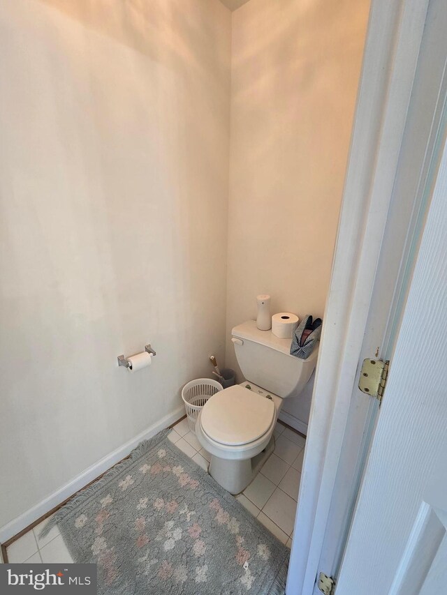 bathroom with tile patterned flooring and toilet