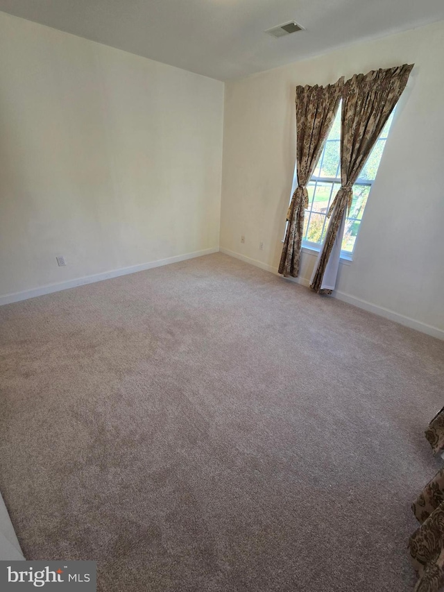 empty room featuring carpet flooring