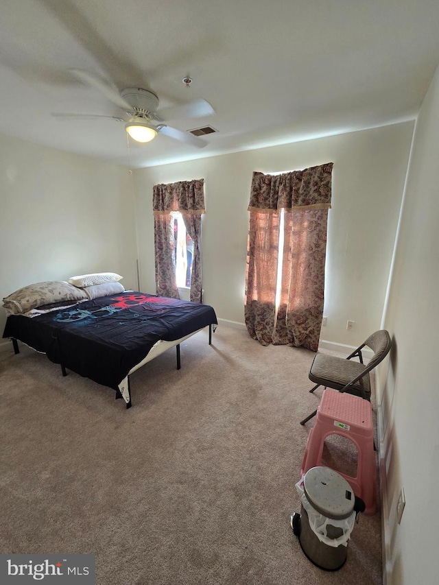 carpeted bedroom with ceiling fan