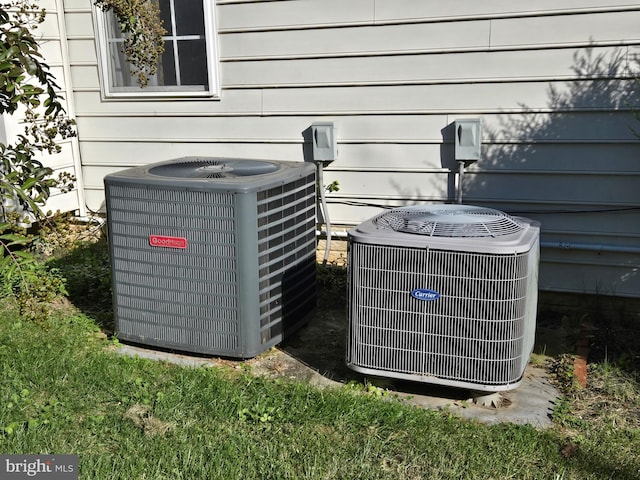 exterior details with cooling unit and wooden walls