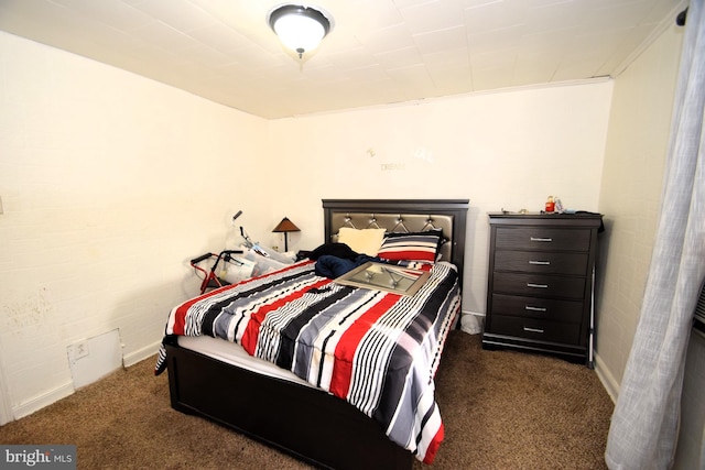 bedroom featuring dark colored carpet