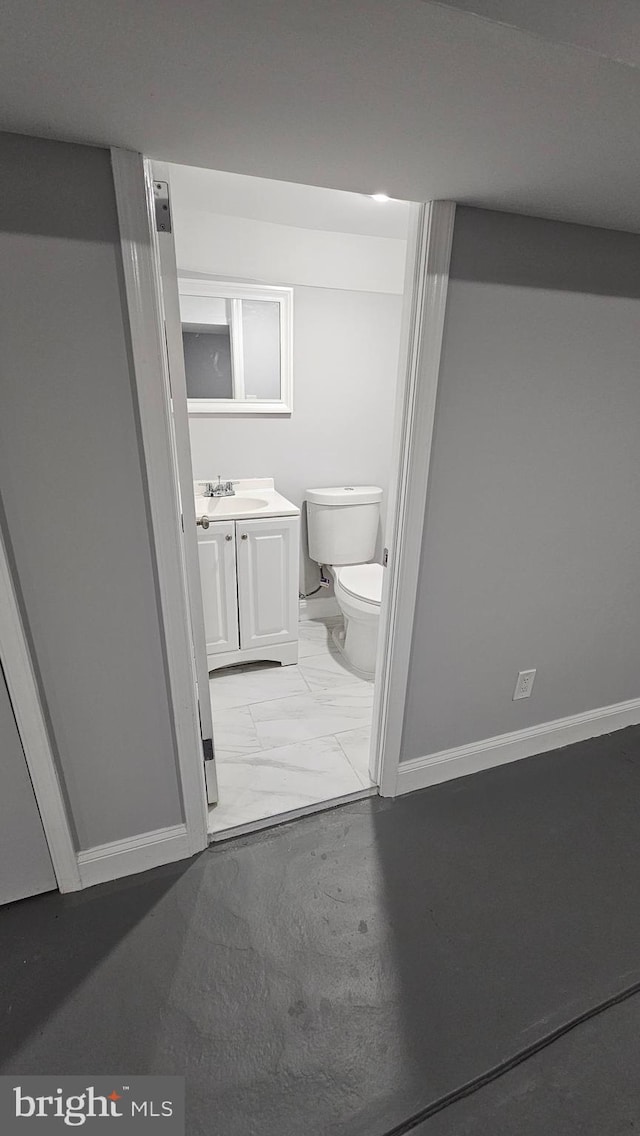 bathroom featuring vanity and toilet