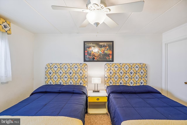 bedroom with ceiling fan and carpet